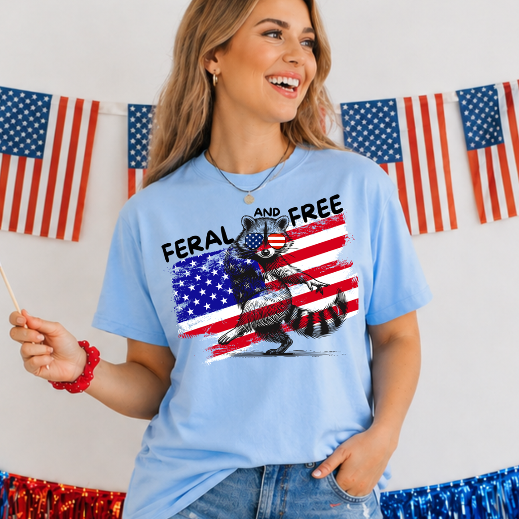 Woman wearing a blue t-shirt with a graphic design in front of American flags.