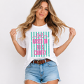 Woman wearing a white t-shirt with 'Raised on 90's Country' design, standing against a plain background.