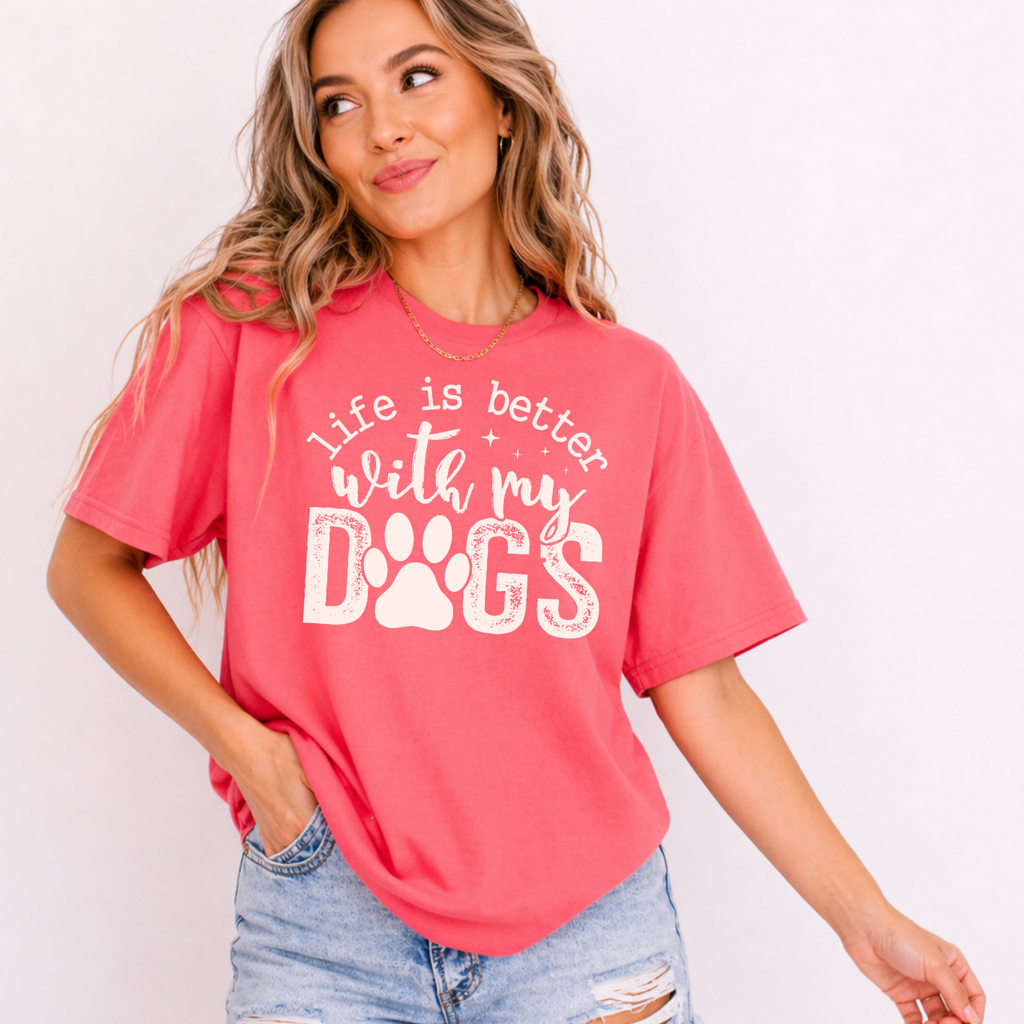 Woman wearing a red t-shirt with 'life is better with my dogs' text on a plain background