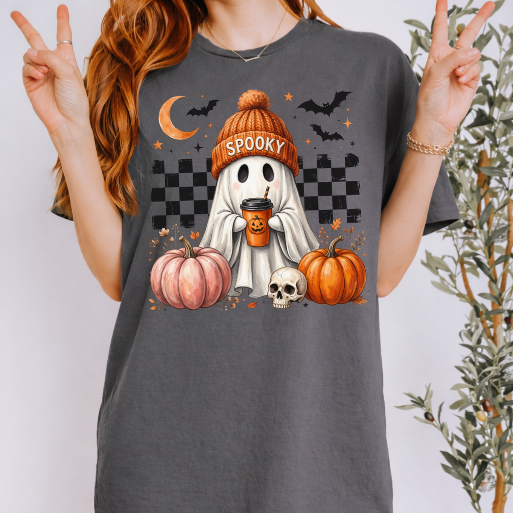 Woman wearing a gray spooky ghost pumpkin coffee graphic tee with pumpkins, bats, and a ghost